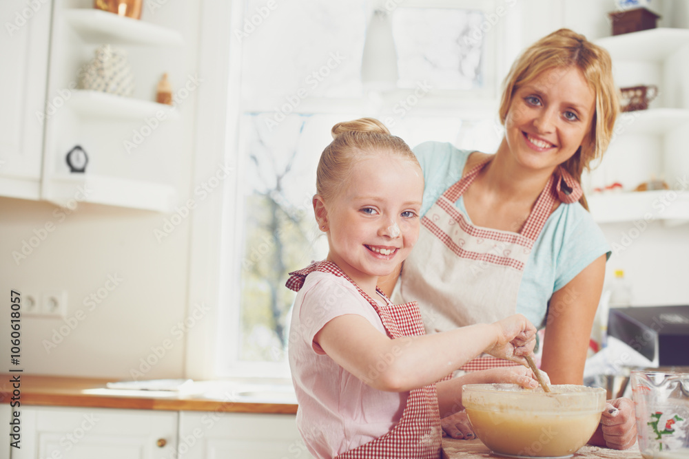 Portrait, kid and mom in kitchen baking with help, learning and happy bonding together for child development. Love, mother and daughter with smile, ingredients and cake recipe in home with girl baker Portrait, kid and mom in kitchen baking with help, learning and happy bonding together for child development. Love, mother and daughter with smile, ingredients and cake recipe in home with girl baker