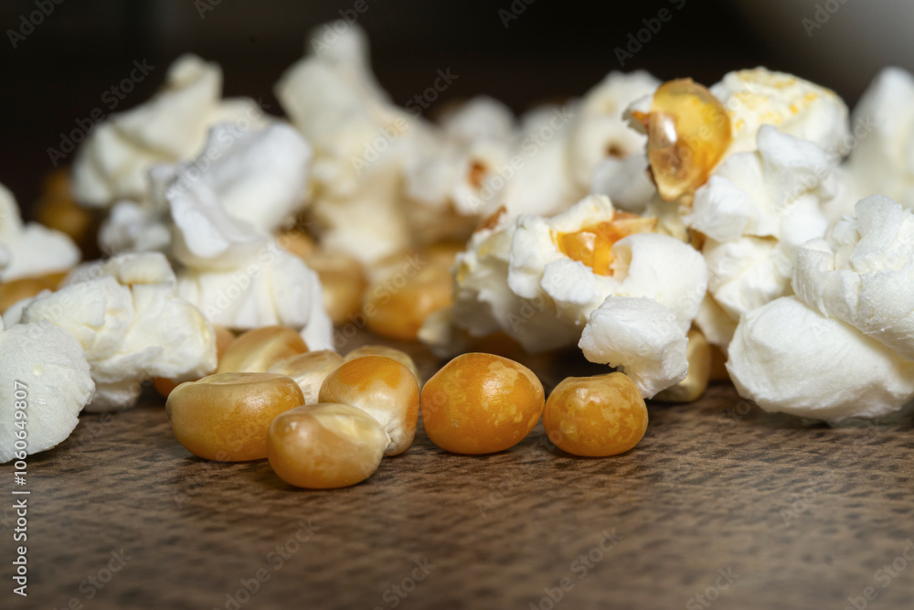 popcorn close up. popcorn with selective focus. popcorn, corn grains on a wooden table popcorn close up. popcorn with selective focus. popcorn, corn grains on a wooden table
