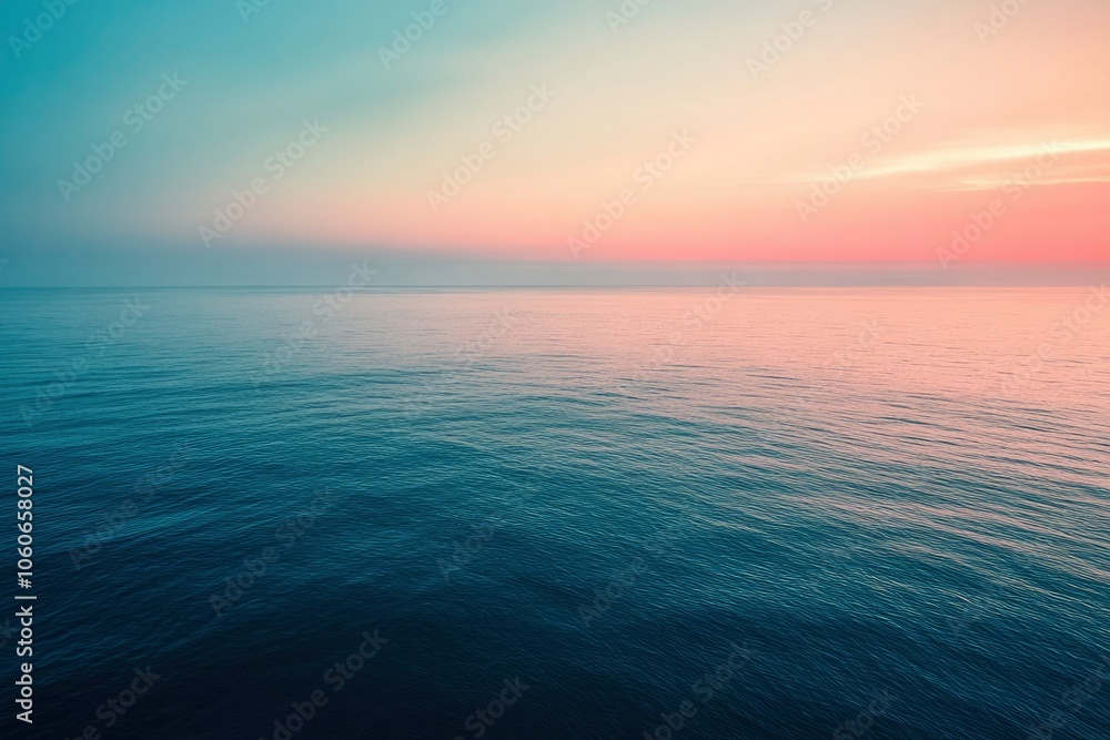 Obraz premium Tranquil Ocean at Dusk with a Pink and Blue Sky