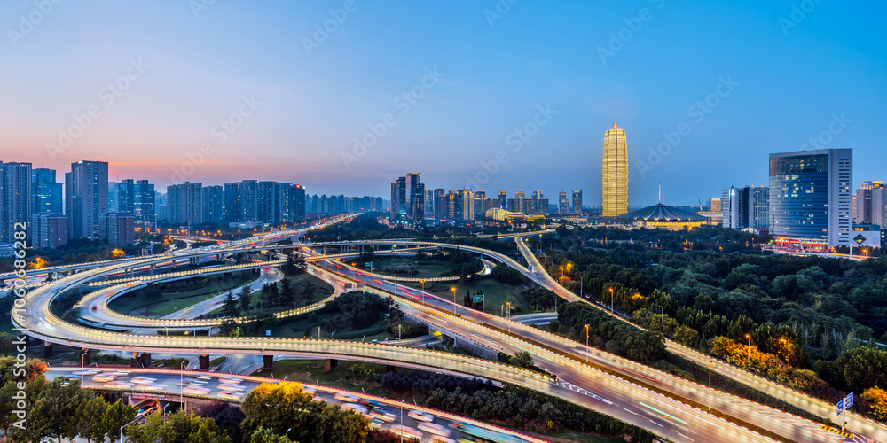 Naklejka premium Night view of CBD and overpass in Zhengdong New District, Zhengzhou, Henan Province, China