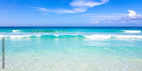 Beautiful ocean wallpaper with vibrant shades of blue and turquoise, featuring waves crashing onto sandy beaches and a clear blue sky above, serene, horizon