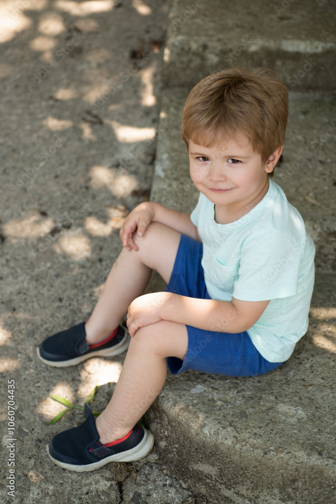 Lifestyle portrait of funny kid outdoors. Summer kids outdoor portrait. Close up face of cute child. Kid having fun outdoor on sunny summer day. Lifestyle portrait of funny kid outdoors. Summer kids outdoor portrait. Close up face of cute child. Kid having fun outdoor on sunny summer day.