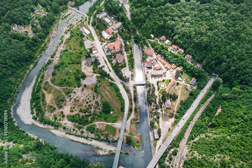 Captivating aerial shot of the traditional town of Ovcar Banja, nestled between mountains and a serene river photo