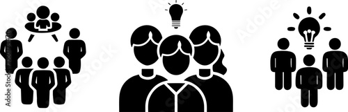 A group of people gathered together, with one person holding a light bulb