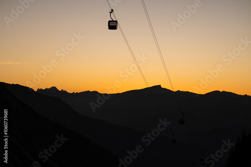 Silhouettes of the Alps at Sunset with a Cable Car Journey into the Mountains