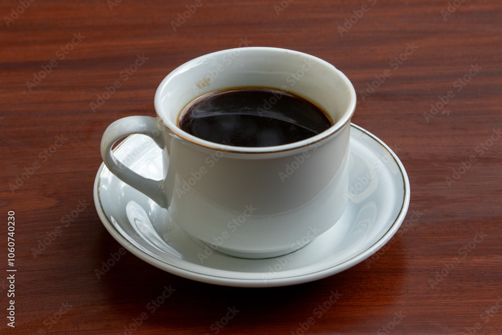 Black Coffee in Ceramic Cup on Wooden Table Black Coffee in Ceramic Cup on Wooden Table