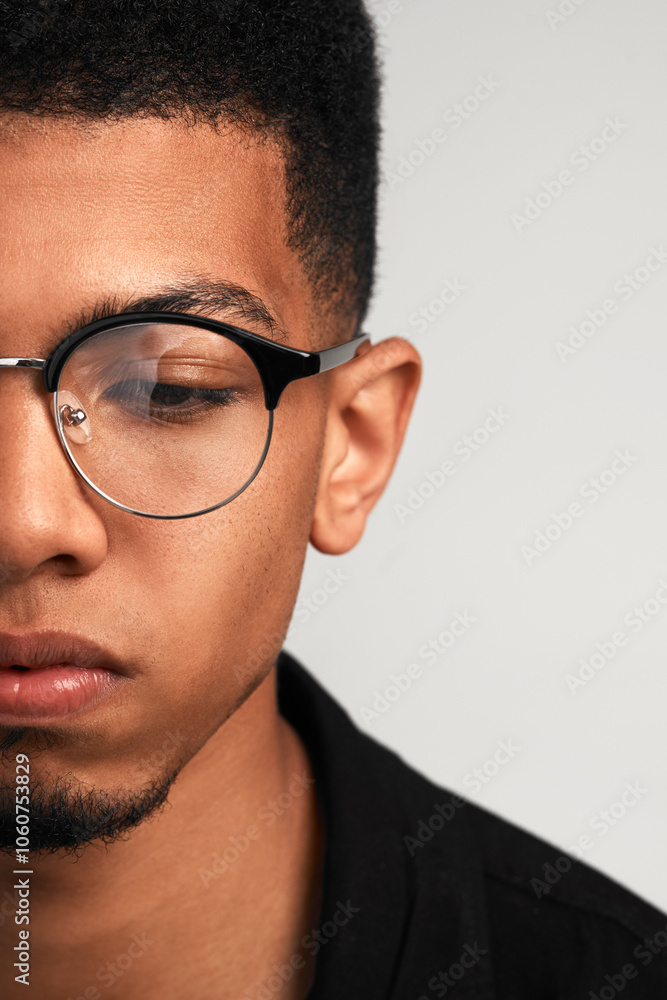 Man, cropped and thinking as student or university tutor for education, learning and career guidance. Male person, half face and planning for ideas, knowledge and scholarship on studio background Man, cropped and thinking as student or university tutor for education, learning and career guidance. Male person, half face and planning for ideas, knowledge and scholarship on studio background