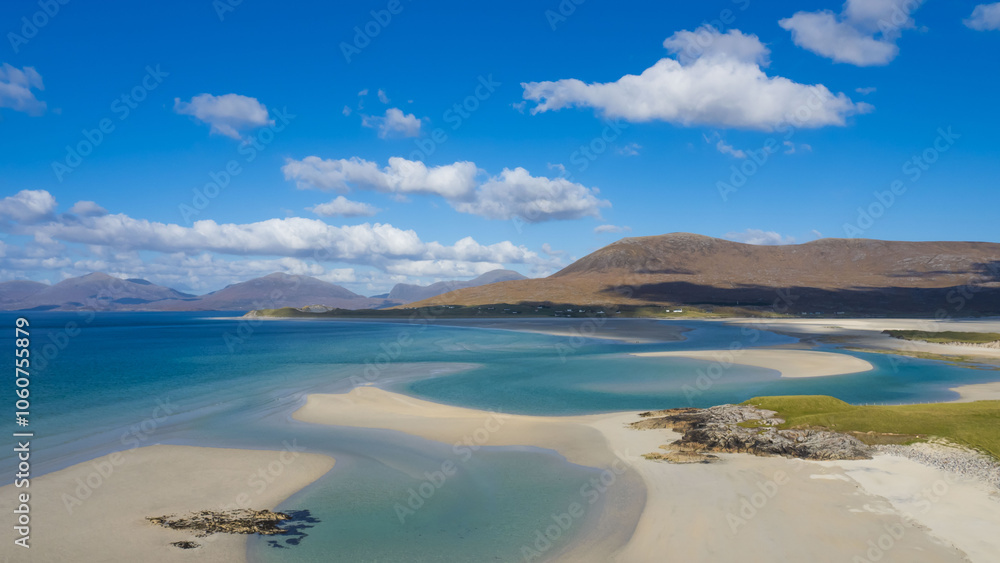 Sandy beach with turquoise water blue sky and white clouds Sandy beach with turquoise water blue sky and white clouds
