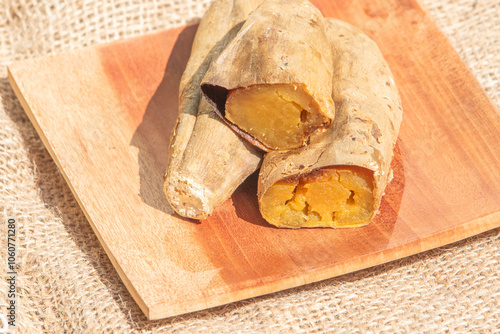 Sweet potato set on wooden board on white background photo