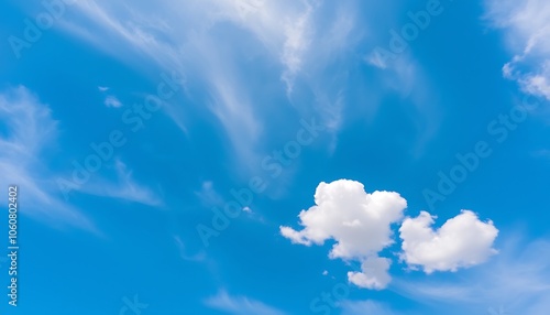 Stunning sky photography, fluffy white cumulus clouds, wispy cirrus clouds, bright azure blue sky, high contras