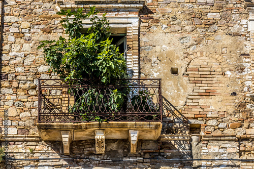 Abandoned ruins of the ghost town of Craco. A city abandoned due to an earthquake in the late 20th century. Province of Matera, Basilicata, Italy photo