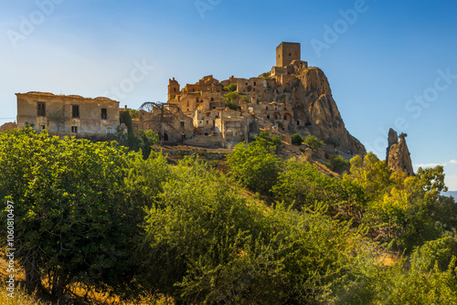 Obraz na płótnie A picturesque view of the abandoned, old mountain town of Craco, built of sandstone rock. Craco is a ghost town abandoned due to an earthquake in the late 20th century. Province of Matera, Basilicata, w salonie