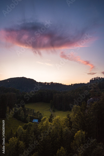 Landscape with purple clouds and forest in foreground, Hrensko, Czech republic