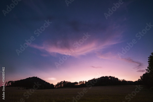 Evening meadow with interesting clouds on purple sky, Hrensko, Czech republic