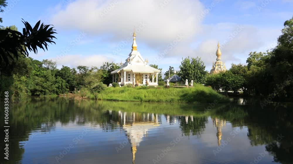 video background of the morning sun light overlooking the old pagoda in the middle of the water(Wat Thung Setthi) in Khon Kaen of Thailand, is beautiful and the blur of the wind blows. video background of the morning sun light overlooking the old pagoda in the middle of the water(Wat Thung Setthi) in Khon Kaen of Thailand, is beautiful and the blur of the wind blows.