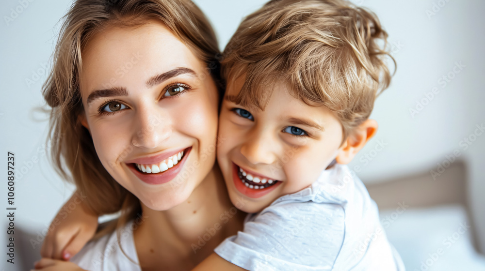 Smiling Mother with Son: A cute young mother smiling with her son on her back, isolated against a white background. Smiling Mother with Son: A cute young mother smiling with her son on her back, isolated against a white background.