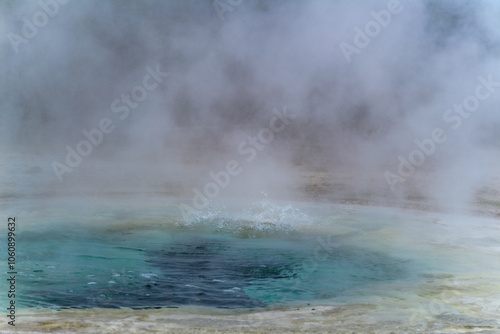 Canvas Print Geysers with hot water spew steam in Yellowstone National Park