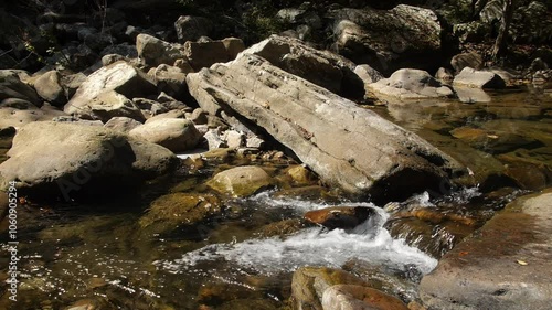 Water cascades past giant boulders in Richland Creek in the Laurel Snow State Natural Area in Tennessee