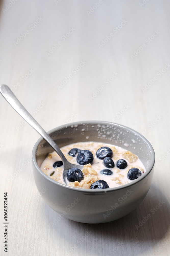 Bright and appetizing breakfast: fresh yogurt with juicy blueberries, crunchy flakes, seeds, and natural grains. Bright and appetizing breakfast: fresh yogurt with juicy blueberries, crunchy flakes, seeds, and natural grains.