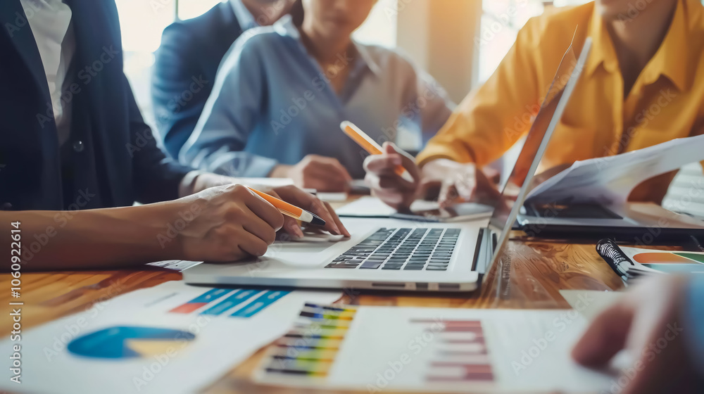 Fototapeta premium Diversity in Digital Meeting: A group of diverse business people in a digital meeting, using laptops for SEO data analytics, finance budget reviews, or project management teamwork