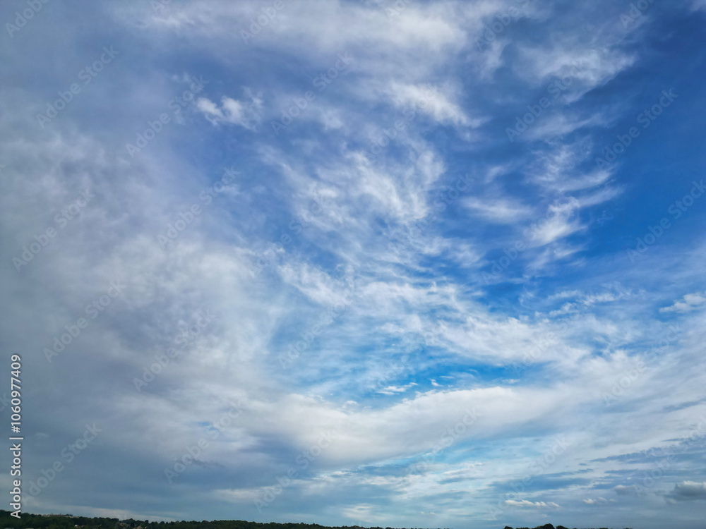 Obraz premium High Angle View of Most Beautiful Clean Sky and Dramatical Clouds over City of England UK. Drone's Camera Footage from High Altitude.