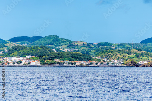 A view from a boat towards the volcanic hills on the island of San Miguel in the Azores in summertime photo