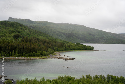 View of green mountains and water in Presteid, Norway