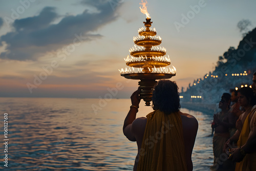 A Sadhu performing the Ganga Aarti ceremony in India, surrounded by the sacred glow of lamps and the river’s flowing waters, embodying devotion, spirituality, and tradition photo