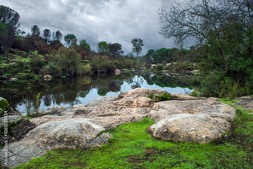 View of the Jándula river in the Sierra de Andujar natural park, Jaen, Andalucia, Spain, with foggy atmosphere photo