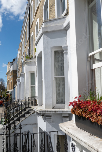 Touristic route on Notting Hill, walking on streets with colourful houses, Portobello road, city life, wealthy neighbourhoods in London, UK photo