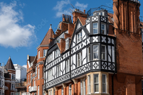Red bricks houses on Hans Crescent street in Royal Borough of Kensington and Chelsea, London, UK