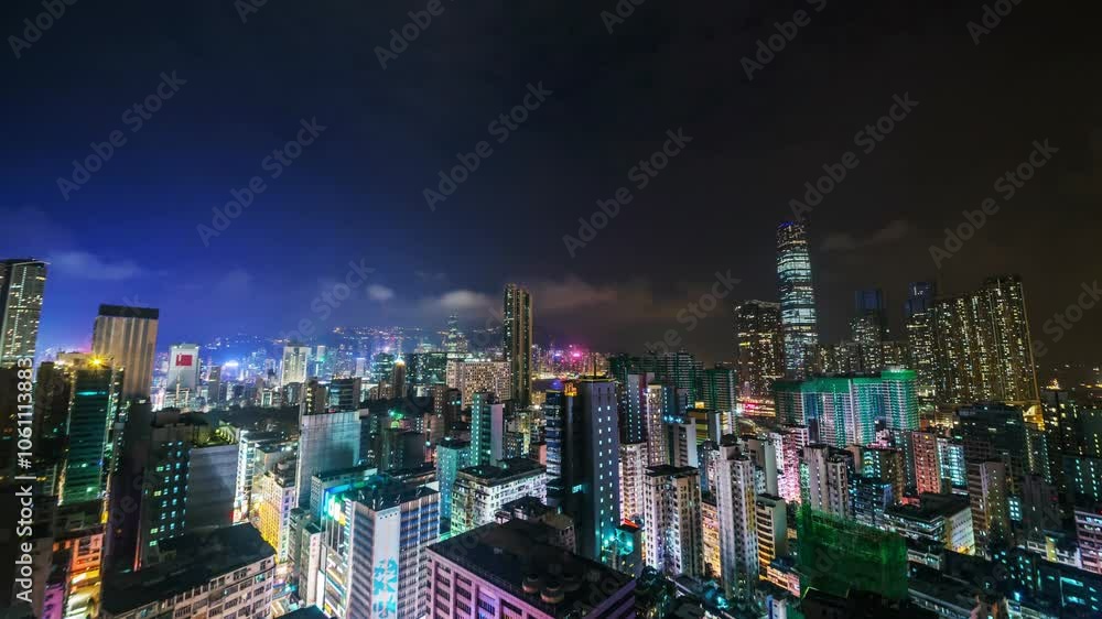 HONG KONG, - OCTOBER 27, 2024: Captivating night view from a rooftop in Mong Kok with vibrant city lights and skyline HONG KONG, - OCTOBER 27, 2024: Captivating night view from a rooftop in Mong Kok with vibrant city lights and skyline