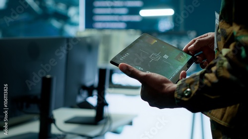 Fotografie Military officer leads cybersecurity operations in a high tech operation room command post, ensuring data protection