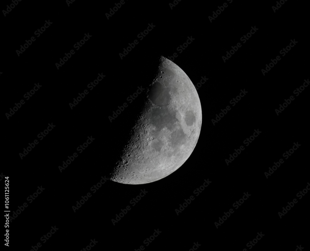 half waxing gibbous moon on night sky half waxing gibbous moon on night sky
