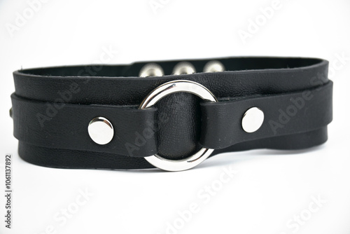 Black leather choker. Isolated on a white background. Space Copy.