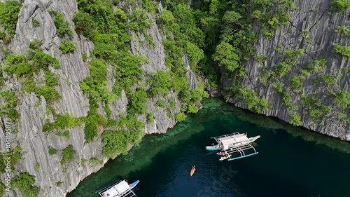 Spectacular Aerial View of Twin Lagoon on Coron Island, Philippines – Turquoise Waters, Small Boats, and Lush Green Cliffs in Stunning 4K Drone Footage
