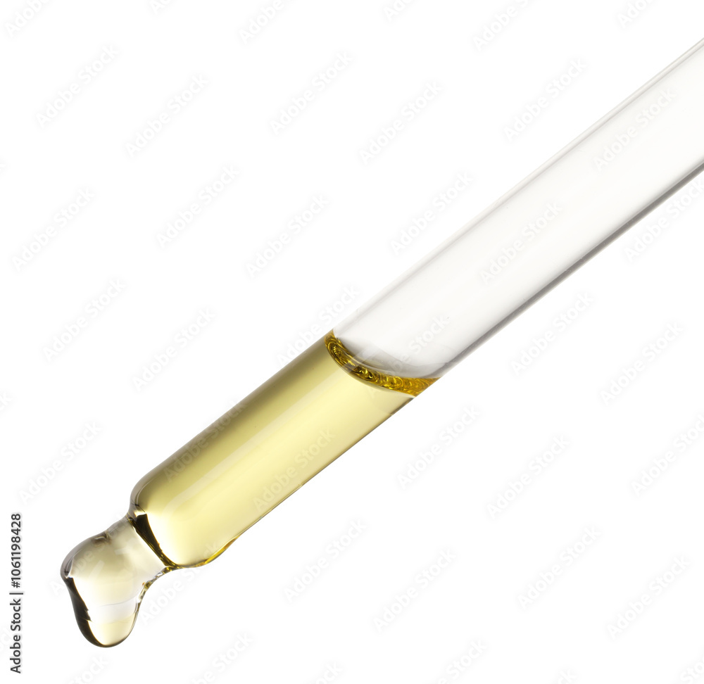 Essential oil dripping from pipette against white background Essential oil dripping from pipette against white background