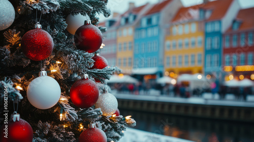 Close-up image of Christmas tree with white and red ornaments in the background of the Copenhagen panorama.