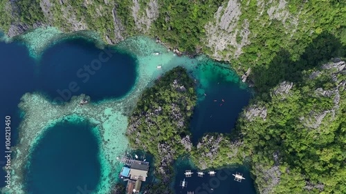 Breathtaking Aerial Panorama of Twin Lagoon and Surrounding Islands at Sunset on Coron Island, Philippines – Turquoise Waters, Boats, and Verdant Cliffs in Stunning 4K Drone Footage