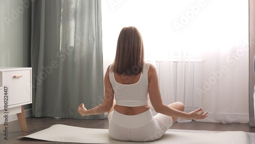 Woman deeply meditating in serene living room environment Enhance your mindfulness journey with guided meditation for inner peace and tranquility. Embrace the transformative power of daily meditation 