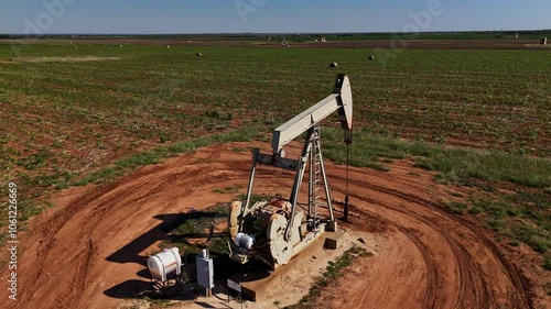 Aerial view of crude oil pumping unit, oil production, tank battery. West Texas. photo