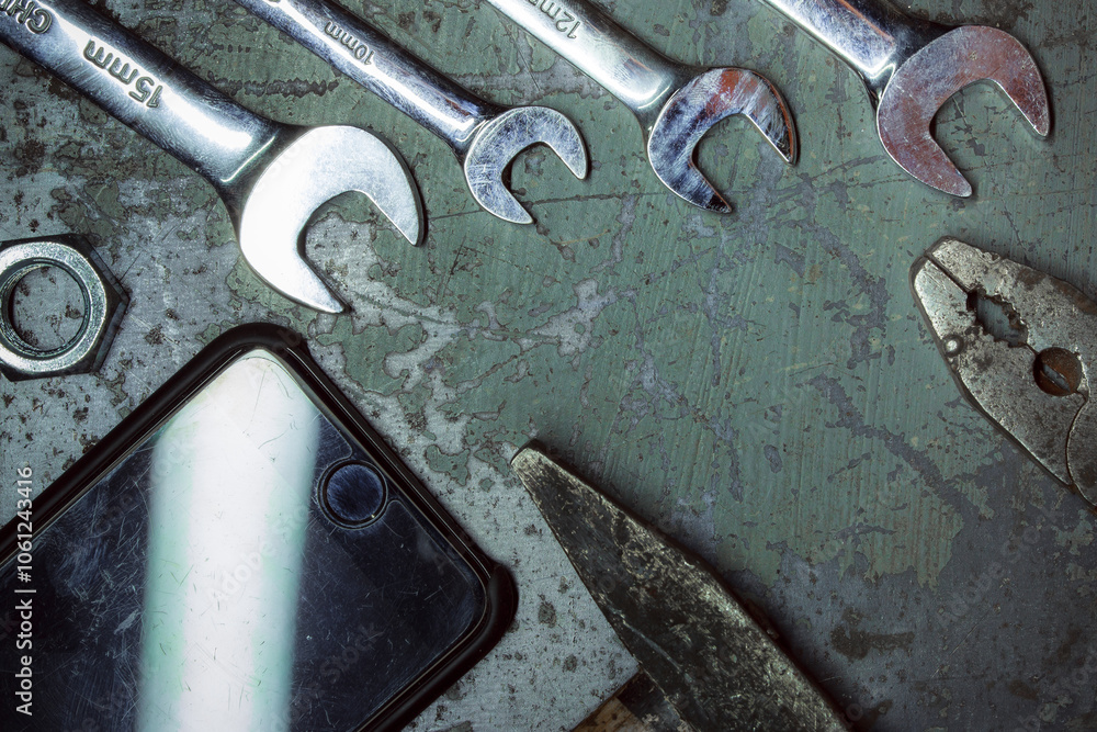 Hand tools for car repair. Concept of the header of the site of technical maintenance of equipment. Gray and metallic shades in the design. Hand tools for car repair. Concept of the header of the site of technical maintenance of equipment. Gray and metallic shades in the design.