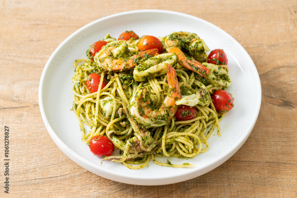 Spaghetti with seafood in homemade pesto sauce Spaghetti with seafood in homemade pesto sauce