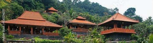 Scenic view of traditional-style buildings surrounded by lush greenery.