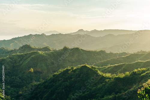 Morning fog in spring mountains. Beautiful sunrise on background. Nature background and Adventure concept