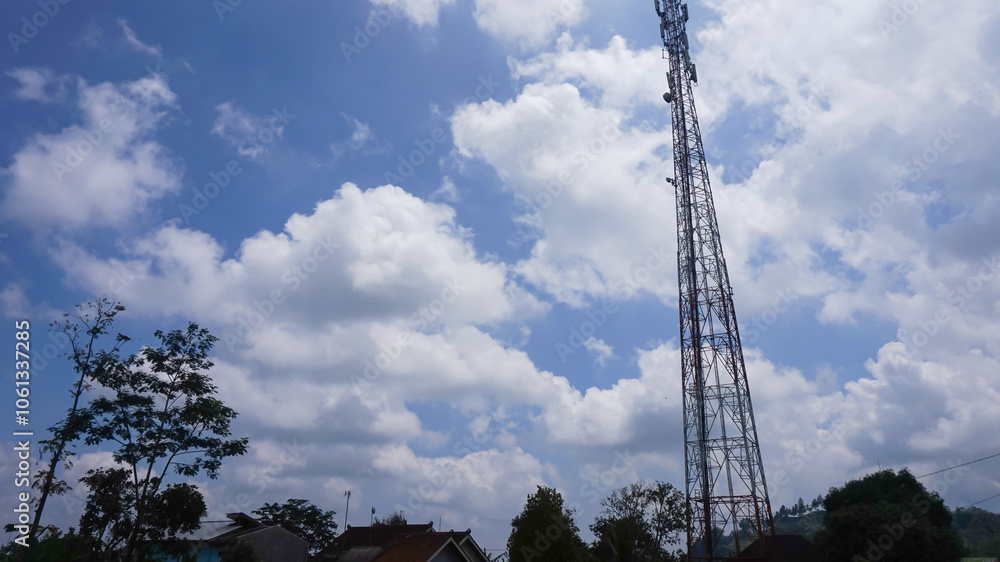 Transmitter tower with blue sky and clouds background Transmitter tower with blue sky and clouds background
