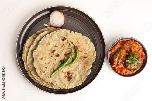 Roti or millet flat bread.Made with chana ,caun, green moong , udad ,ragi , Jowar farmer's lunch Indian bread with Brinjal curry photo