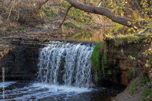 View of Sablinsky Waterfall on a sunny October day. Leningrad Region, Russia photo