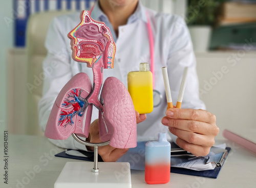Foto Doctor holds vape cigarettes and lung anatomy