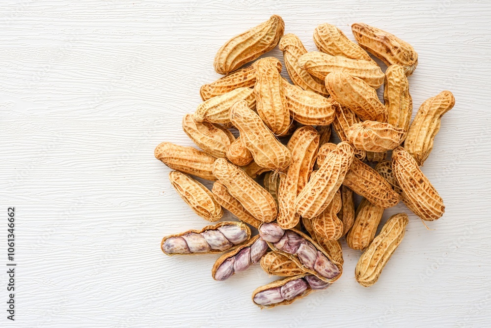Boiled Peanuts in wooden bowl on white background Boiled Peanuts in wooden bowl on white background